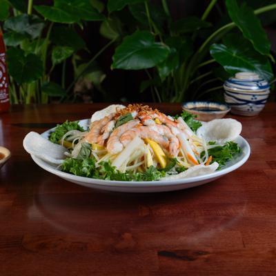 Vietnamese salad with shrimp, lotus, green papaya, and shrimp crackers.