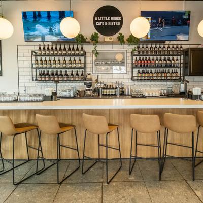 The serving counter and stools.