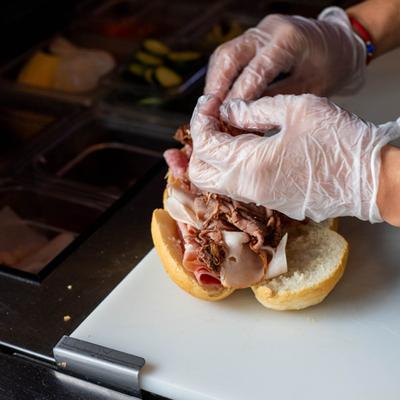A chef making a sandwich