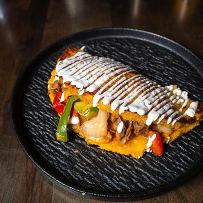 Served philly cheese steak cachapa.