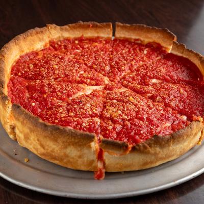 A whole Chicago deep dish pizza.