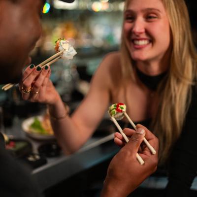 Customers eating sushi.