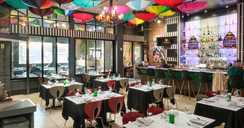 Interior, dining area with bar in the back