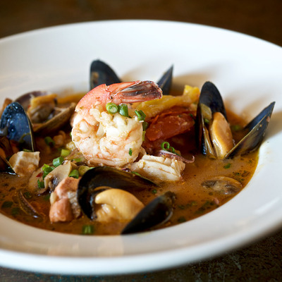 Seafood Stew with Salmon, clams, mussels, prawns, calamari, tomato fennel broth