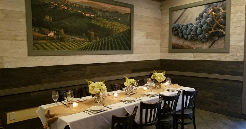 Interior, tables and chairs with pictures in the back