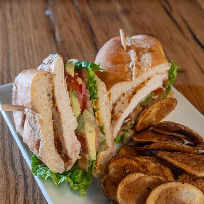 Grilled chicken sandwich served with house-made potato chips.