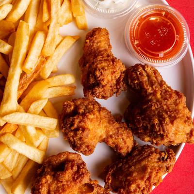 Fried chicken wings with buffalo sauce and blue cheese.
