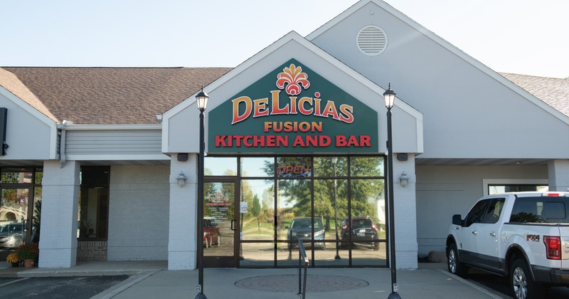 Exterior, front view to restaurant, entrance, sign above