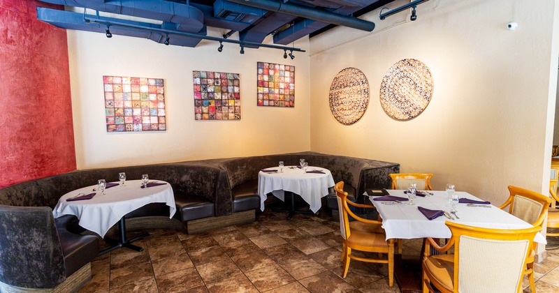 Interior seating area with chairs, tables and booths