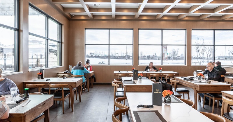 Interior, seating area by windows with guests