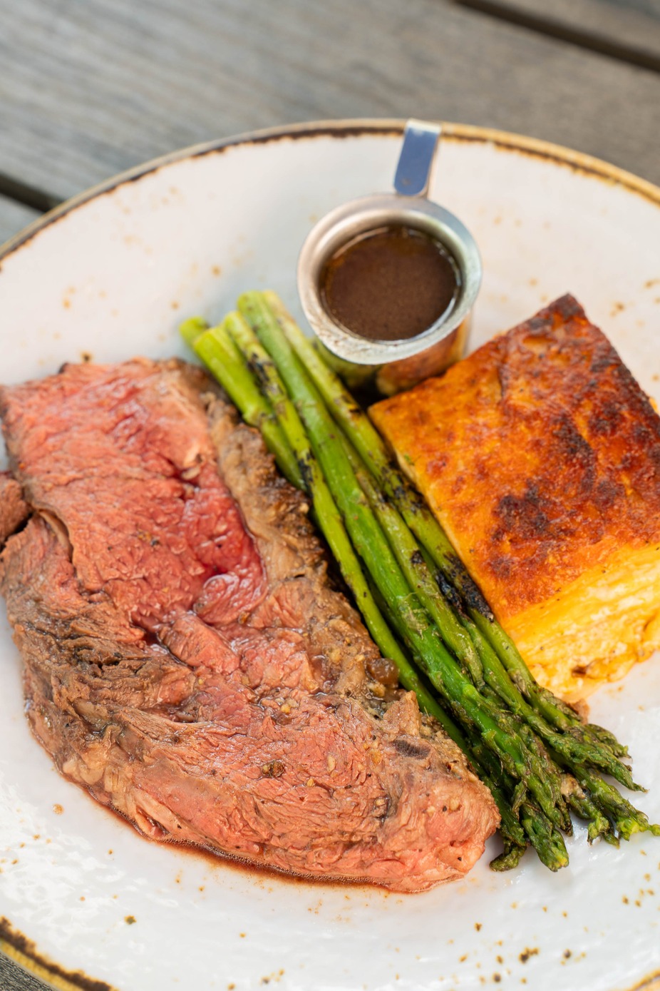 Roasted Prime Rib - Santa Maria spice-rubbed 120z prime rib, oven-roasted and served with grilled asparagus and gratinee potatoes
