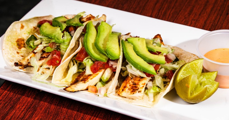 Chicken soft tacos with lime and cheese sauce dip