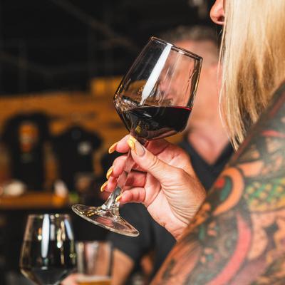 People drinking red wine.