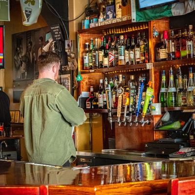 A person behind the bar.