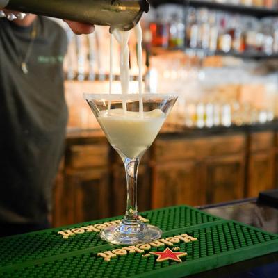 Bartender pouring a Martini.