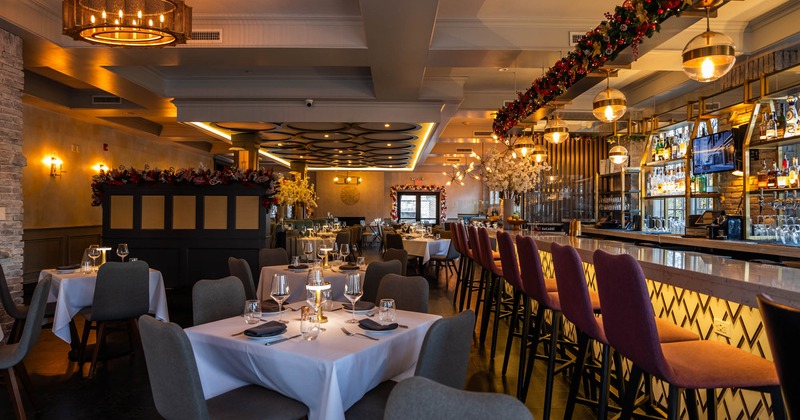 Interior, dining area, set tables with lamp as centerpiece, various chandeliers