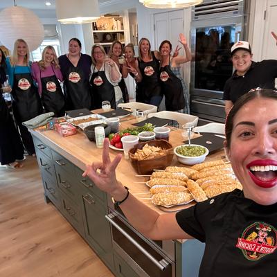 Master Chef with a group of students in cooking class.