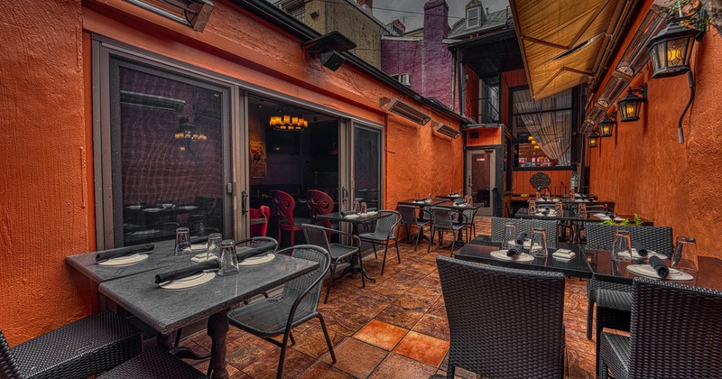 Interior, tables set for guests on patio