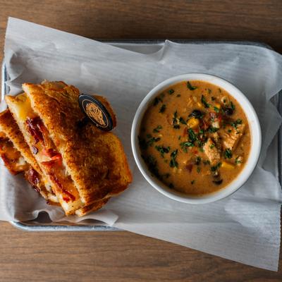 A soup and grilled cheese sandwiches.