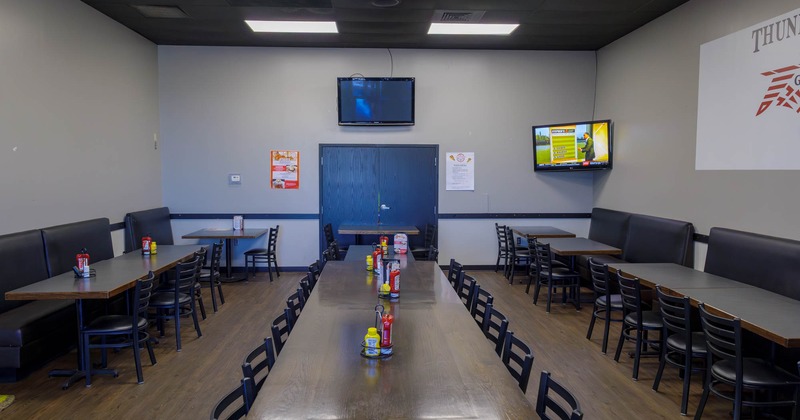 Interior, dining area with tables, chairs and booths