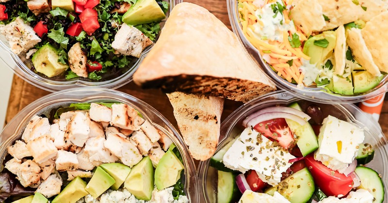 Assorted salads spread on a table, top view