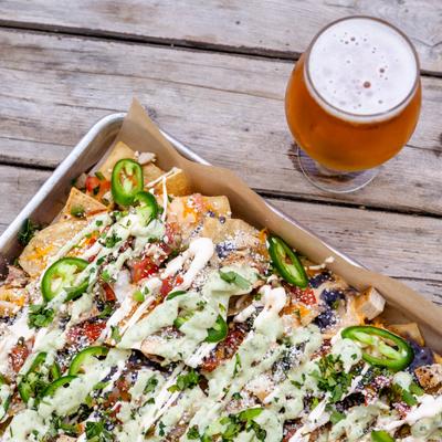 980 Nachos with beer, served, top view, closeup.
