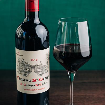 Chateau St. George red wine bottle and glass..