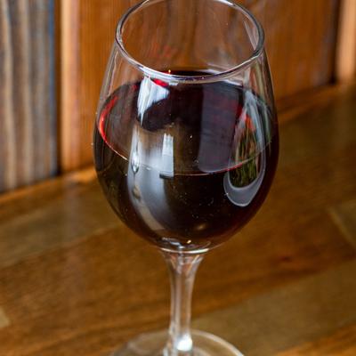 A glass of red wine.