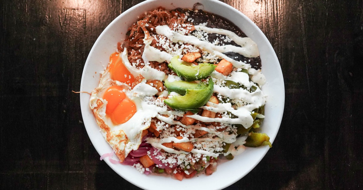 Mexican breakfast bowl with fried eggs