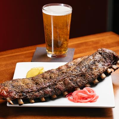 Pork ribs and a glass of beer.