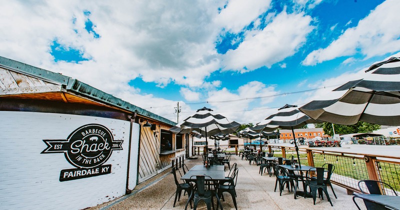 Exterior, tables with parasols and chairs