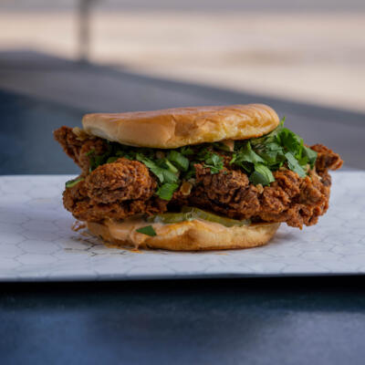 Cinnamon Chipotle Chicken Sandwich on a white plate.