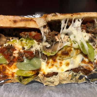 Italian Sausage Sandwich, with pizza sauce, green peppers, onions, and cheese.