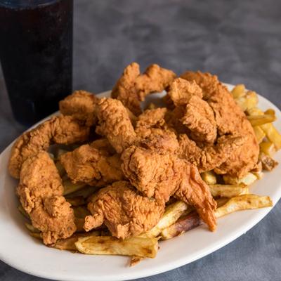 Chicken Tenders served on a bed of fries.