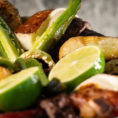 Molcajete with charbroiled steak, chicken, chorizo, cactus, onions, jalapeno, and cheese.