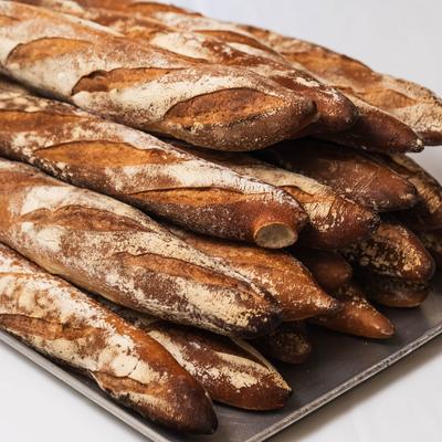 Rustic baguettes on a tray.