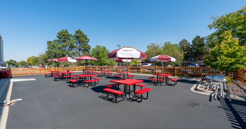 Exterior, wooden benches and tables with parasols