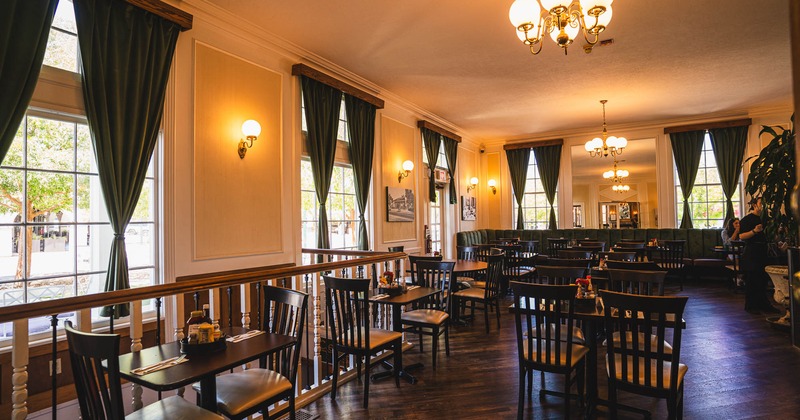Interior, tables and chairs in dining area