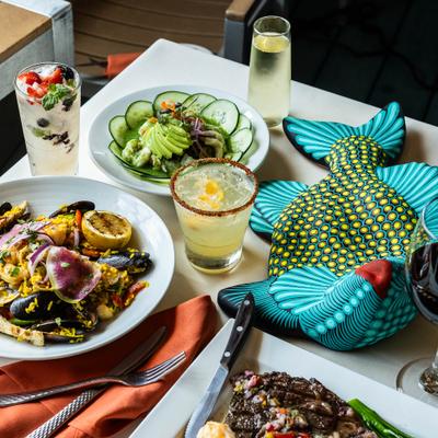 Table set with different meals and drinks.