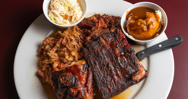 Living the dream plate with sides of coleslaw and mashed potatoes with gravy