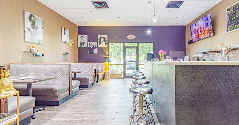 Interior, dining booths, TV and decorations on walls