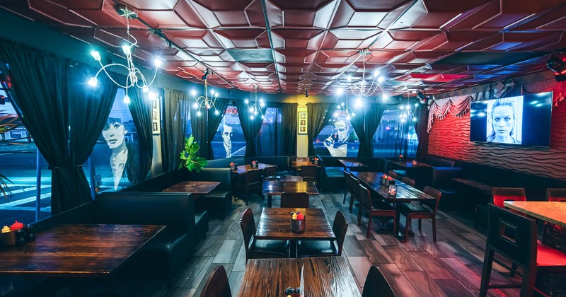 Interior, dining tables and chairs, booth area on the left