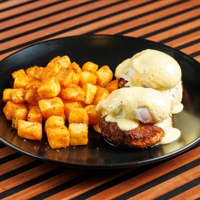 Crab Cake Eggs Benedict, with potatoes.