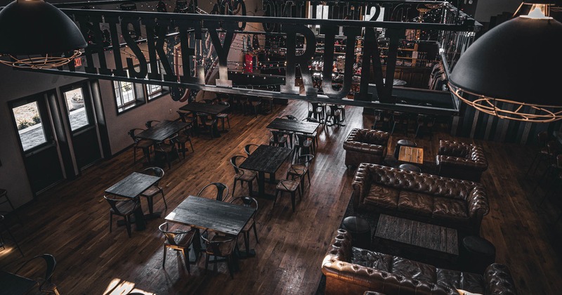 Interior, open space dining area, top view, dining tables, lounge area with sofas and chairs