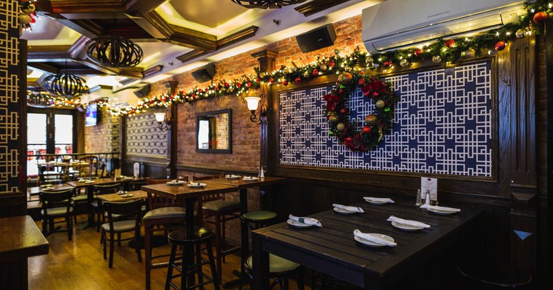 Tall tables and bar stools set, ready for guests