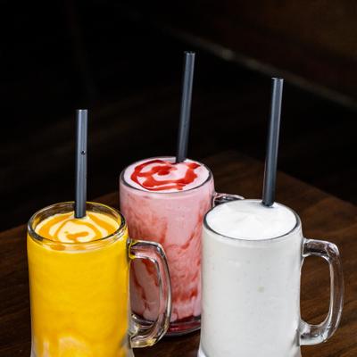 Variety of frozen drinks served in mugs.
