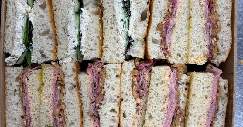 Club sandwich platter featuring assorted fillings on multigrain bread