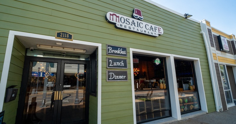 Side view to restaurant entrance, sign above