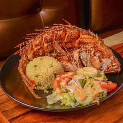 Fried Red Snapper, with rice and salad.