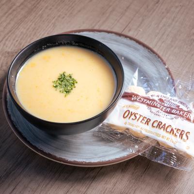 Lobster bisque bowl served with oyster crackers.